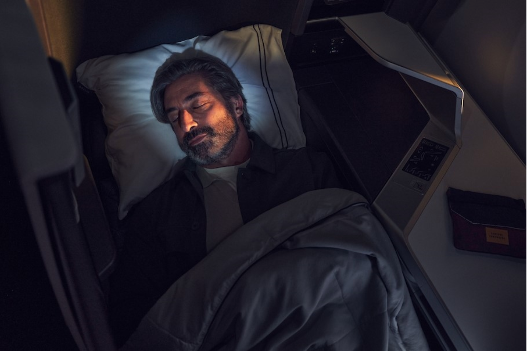 Photo of man sleeping in Delta One Suites