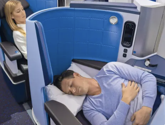 Photo of man sleeping in KLM business class