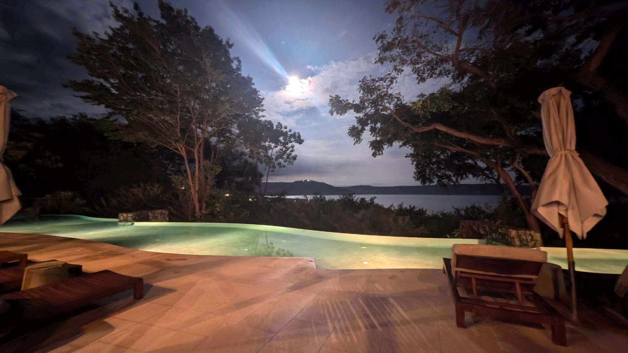 Watch the sun break through the clouds poolside at the Andaz Papagayo - Source: You Are Travel