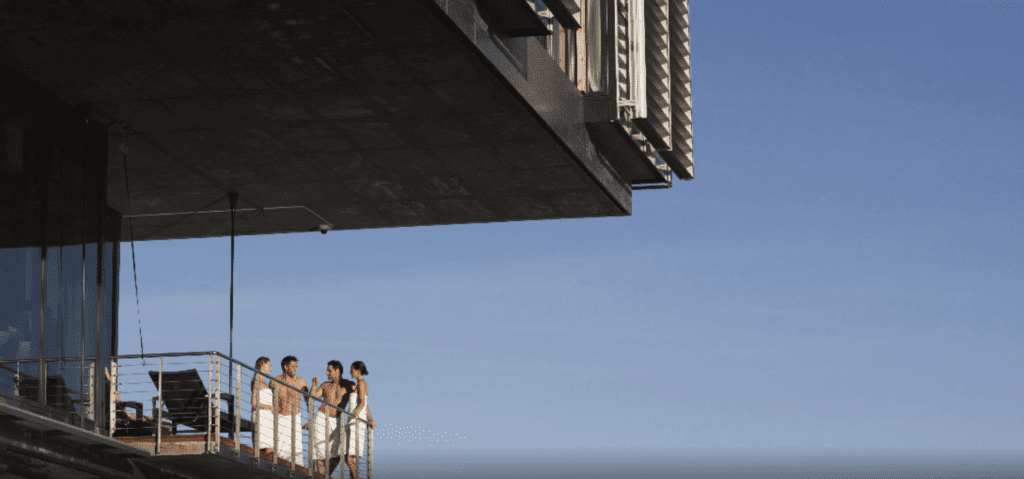 a group of people standing on a balcony