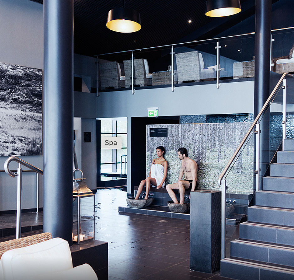 a couple of people sitting on a bench in a spa