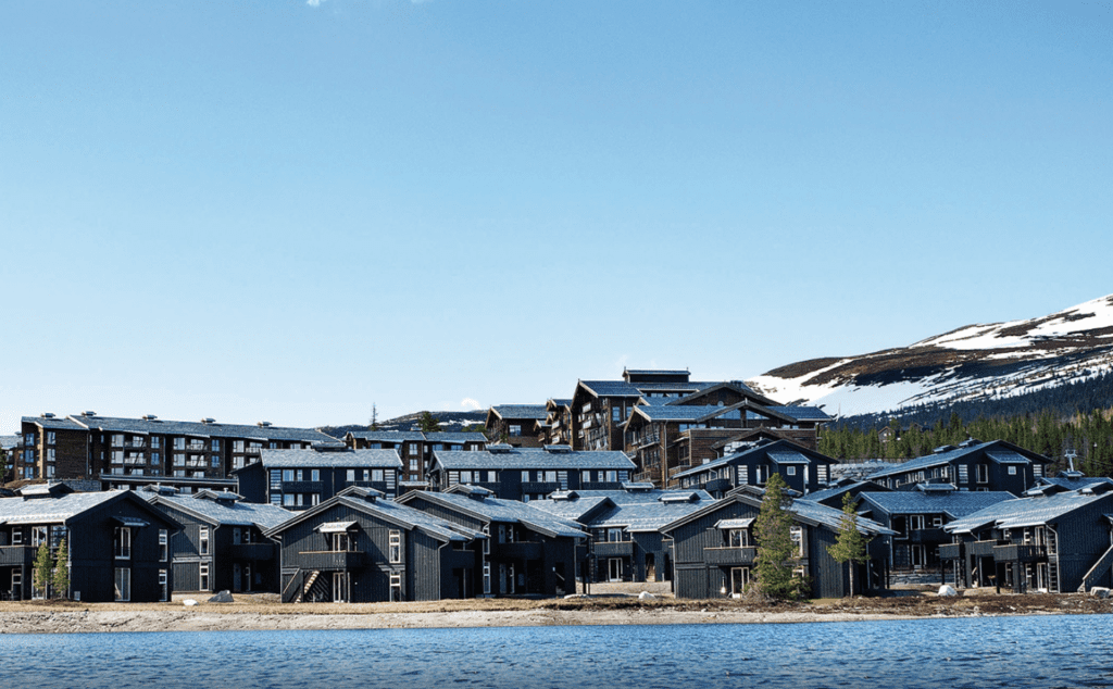 a group of houses by a lake