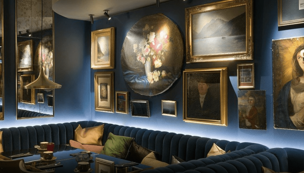 a room with a couch and pictures on the wall