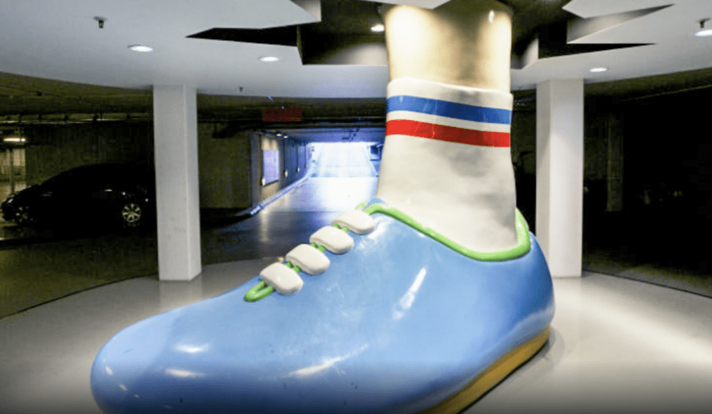 a blue shoe with white stripes and red and blue stripes