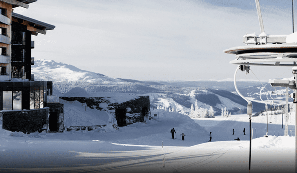 a group of people skiing on a snowy mountain