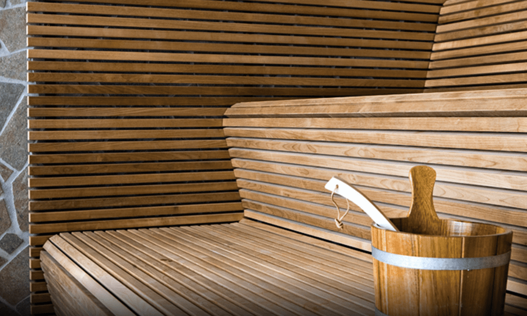 a wooden bucket with a handle in it