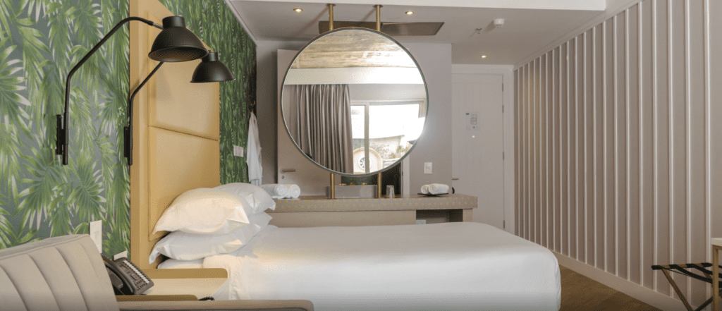 a mirror above a bed
