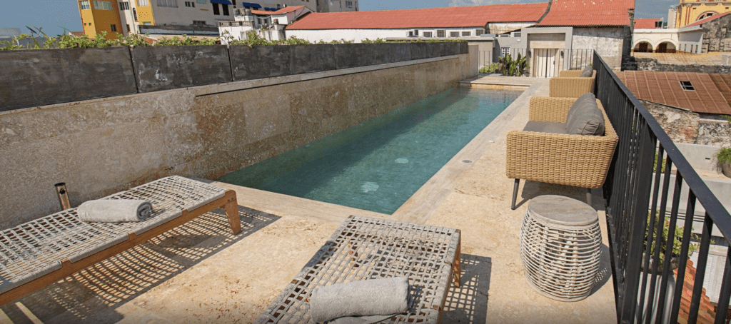 a pool with chairs and a chair on the side