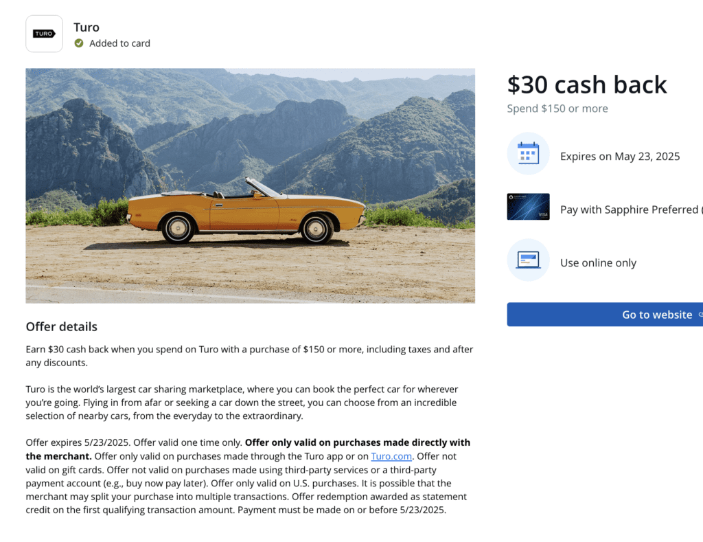 a yellow convertible car parked on a dirt road with mountains in the background