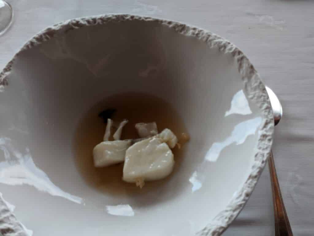 a bowl of soup with a fork