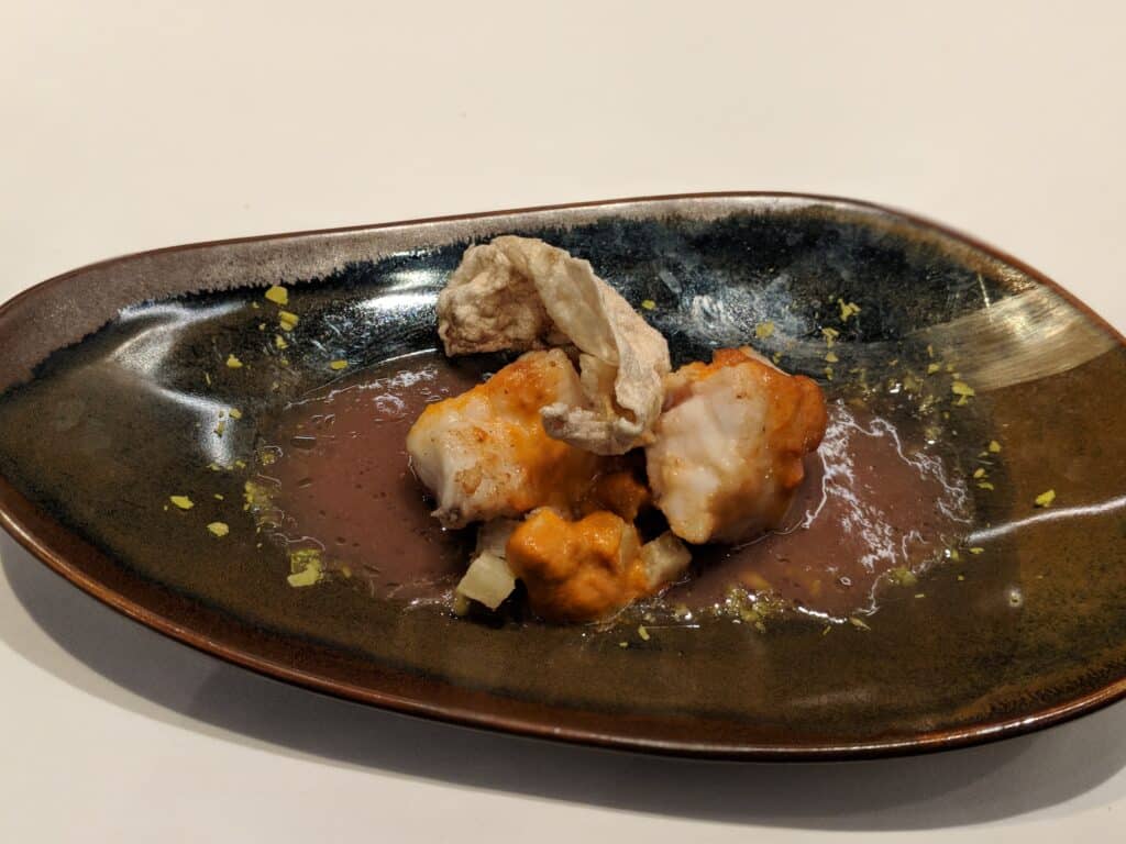 a plate of food on a white surface