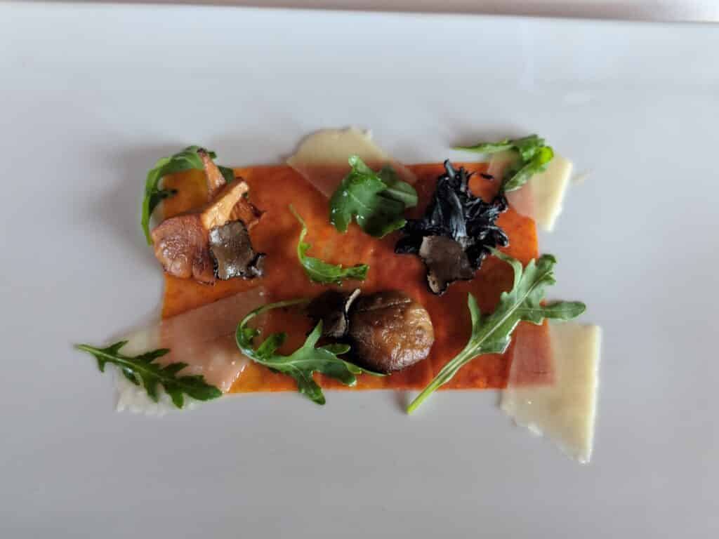 a plate of food on a white surface