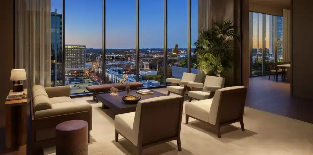 a room with a large window overlooking a city