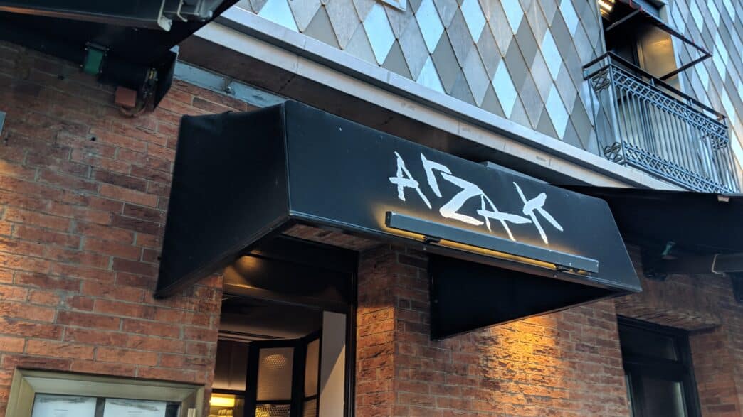 a building with a black awning