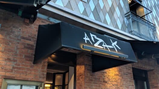 a building with a black awning