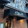 a building with a black awning