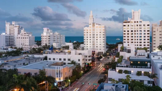 a city with many white buildings and trees