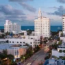 a city with many white buildings and trees