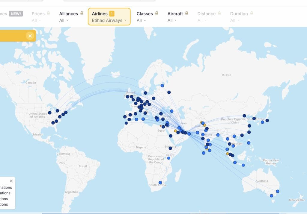 a map of the world with blue dots