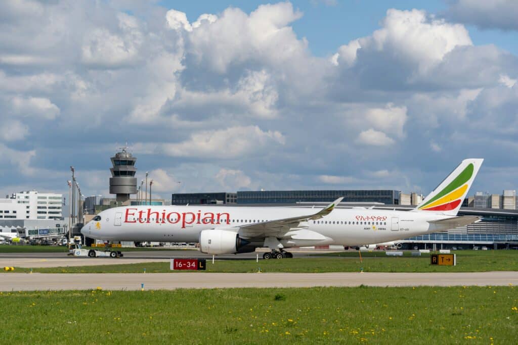 a large white airplane on a runway