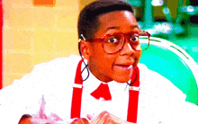 a boy wearing red glasses