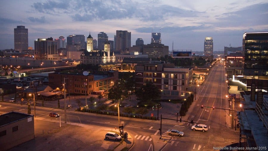 a city at night with a city skyline